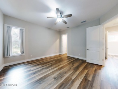 Country living meets modern convenience in this serene wooded on New Smyrna Beach Golf Course in Florida - for sale on GolfHomes.com, golf home, golf lot
