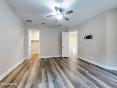 Country living meets modern convenience in this serene wooded on New Smyrna Beach Golf Course in Florida - for sale on GolfHomes.com, golf home, golf lot