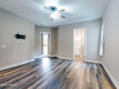 Country living meets modern convenience in this serene wooded on New Smyrna Beach Golf Course in Florida - for sale on GolfHomes.com, golf home, golf lot