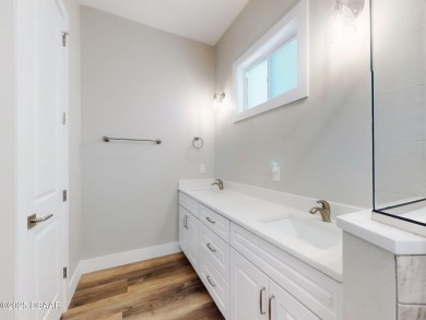 Country living meets modern convenience in this serene wooded on New Smyrna Beach Golf Course in Florida - for sale on GolfHomes.com, golf home, golf lot
