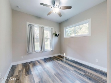 Country living meets modern convenience in this serene wooded on New Smyrna Beach Golf Course in Florida - for sale on GolfHomes.com, golf home, golf lot