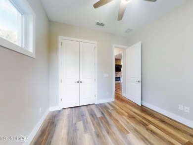 Country living meets modern convenience in this serene wooded on New Smyrna Beach Golf Course in Florida - for sale on GolfHomes.com, golf home, golf lot