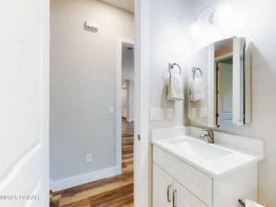 Country living meets modern convenience in this serene wooded on New Smyrna Beach Golf Course in Florida - for sale on GolfHomes.com, golf home, golf lot