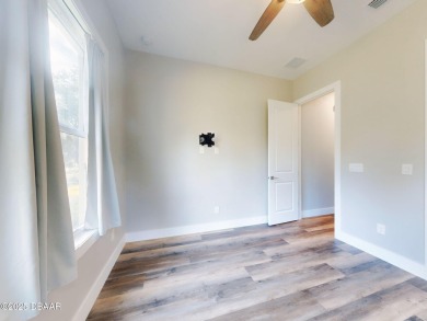 Country living meets modern convenience in this serene wooded on New Smyrna Beach Golf Course in Florida - for sale on GolfHomes.com, golf home, golf lot