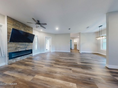 Country living meets modern convenience in this serene wooded on New Smyrna Beach Golf Course in Florida - for sale on GolfHomes.com, golf home, golf lot