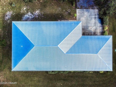 Country living meets modern convenience in this serene wooded on New Smyrna Beach Golf Course in Florida - for sale on GolfHomes.com, golf home, golf lot