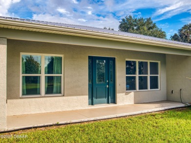 Country living meets modern convenience in this serene wooded on New Smyrna Beach Golf Course in Florida - for sale on GolfHomes.com, golf home, golf lot