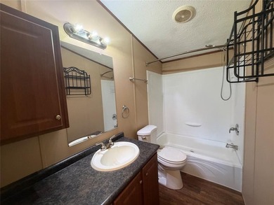 Discover the perfect waterfront getaway on Lake Fork! This on Links At Lands End in Texas - for sale on GolfHomes.com, golf home, golf lot