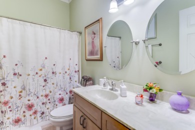 This beautiful Custom Home in Diamondhead has elegant upgrades on Diamondhead Country Club in Mississippi - for sale on GolfHomes.com, golf home, golf lot