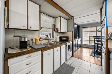 Grab your Towel and Sunscreen and WALK to the Heated Salt Water on Zellwood Station Country Club in Florida - for sale on GolfHomes.com, golf home, golf lot