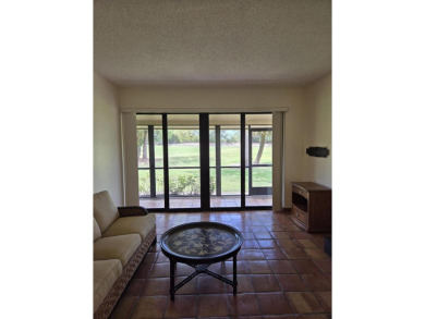 Fabulous and most desired 1 level end unit patio home with 2 BR on PGA National Golf Club in Florida - for sale on GolfHomes.com, golf home, golf lot