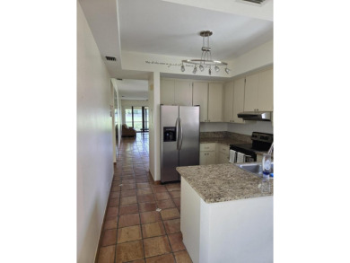 Fabulous and most desired 1 level end unit patio home with 2 BR on PGA National Golf Club in Florida - for sale on GolfHomes.com, golf home, golf lot