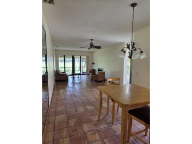 Fabulous and most desired 1 level end unit patio home with 2 BR on PGA National Golf Club in Florida - for sale on GolfHomes.com, golf home, golf lot