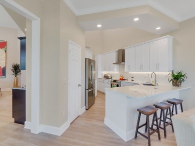 Stunning designer renovation of this two story Victoria Island on Grand Harbor Golf and Country Club in Florida - for sale on GolfHomes.com, golf home, golf lot