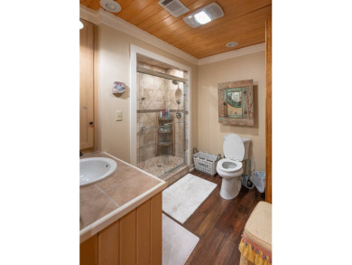 This stunningly renovated 5-bedroom, 3-bath ranch-style home on Lake Bruin Golf and Country Club in Louisiana - for sale on GolfHomes.com, golf home, golf lot