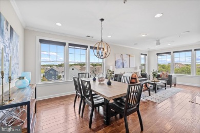 Discover your dream retreat in this stunning top-floor end unit on Bayside Resort Golf Club in Delaware - for sale on GolfHomes.com, golf home, golf lot
