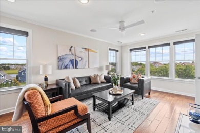 Discover your dream retreat in this stunning top-floor end unit on Bayside Resort Golf Club in Delaware - for sale on GolfHomes.com, golf home, golf lot