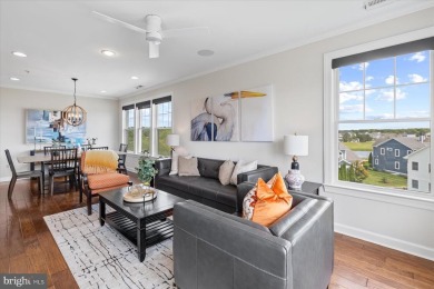 Discover your dream retreat in this stunning top-floor end unit on Bayside Resort Golf Club in Delaware - for sale on GolfHomes.com, golf home, golf lot