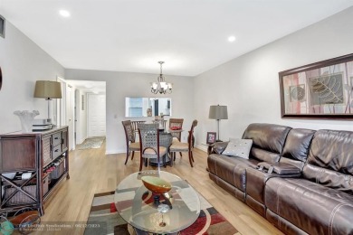 This  2 bd /1.5 bath features laminated floors throughout on Flamingo Lakes Country Club in Florida - for sale on GolfHomes.com, golf home, golf lot