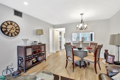 This  2 bd /1.5 bath features laminated floors throughout on Flamingo Lakes Country Club in Florida - for sale on GolfHomes.com, golf home, golf lot