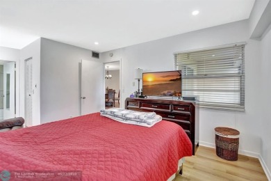 This  2 bd /1.5 bath features laminated floors throughout on Flamingo Lakes Country Club in Florida - for sale on GolfHomes.com, golf home, golf lot