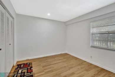This  2 bd /1.5 bath features laminated floors throughout on Flamingo Lakes Country Club in Florida - for sale on GolfHomes.com, golf home, golf lot