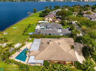 Luxurious Lakefront Oasis,nestled within this prestigious gated on The President Country Club in Florida - for sale on GolfHomes.com, golf home, golf lot