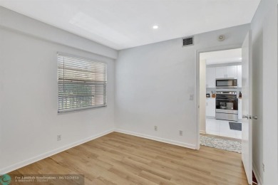 This  2 bd /1.5 bath features laminated floors throughout on Flamingo Lakes Country Club in Florida - for sale on GolfHomes.com, golf home, golf lot