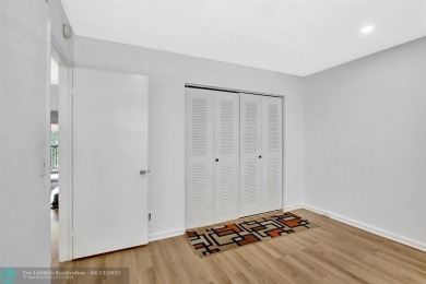 This  2 bd /1.5 bath features laminated floors throughout on Flamingo Lakes Country Club in Florida - for sale on GolfHomes.com, golf home, golf lot