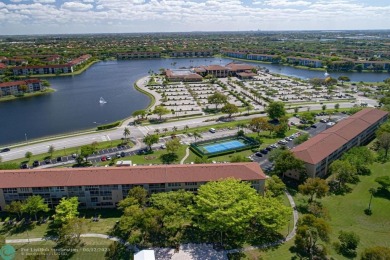 This  2 bd /1.5 bath features laminated floors throughout on Flamingo Lakes Country Club in Florida - for sale on GolfHomes.com, golf home, golf lot