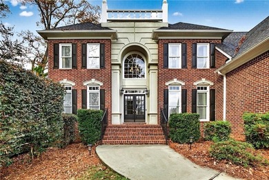 This stunning home in the prestigious gated with security guard on Whitewater Creek in Georgia - for sale on GolfHomes.com, golf home, golf lot