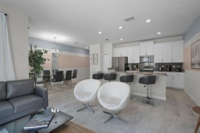Discover the perfect blend of comfort, style, and location at on The Oasis Club at Champions Gate in Florida - for sale on GolfHomes.com, golf home, golf lot