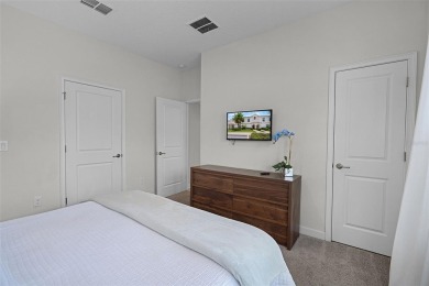Discover the perfect blend of comfort, style, and location at on The Oasis Club at Champions Gate in Florida - for sale on GolfHomes.com, golf home, golf lot