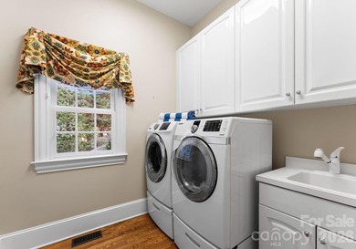 Timeless Southern charm meets lake living! Situated on a large on Trump National Golf Club Charlotte in North Carolina - for sale on GolfHomes.com, golf home, golf lot