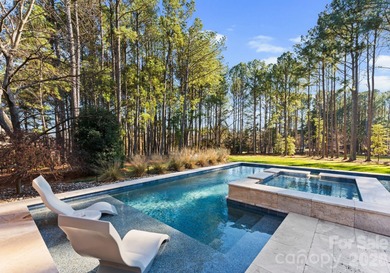 Timeless Southern charm meets lake living! Situated on a large on Trump National Golf Club Charlotte in North Carolina - for sale on GolfHomes.com, golf home, golf lot