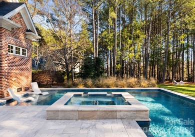 Timeless Southern charm meets lake living! Situated on a large on Trump National Golf Club Charlotte in North Carolina - for sale on GolfHomes.com, golf home, golf lot