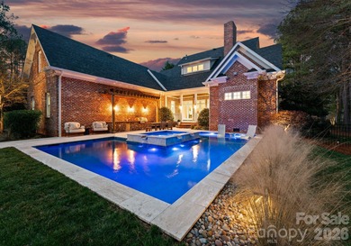 Timeless Southern charm meets lake living! Situated on a large on Trump National Golf Club Charlotte in North Carolina - for sale on GolfHomes.com, golf home, golf lot