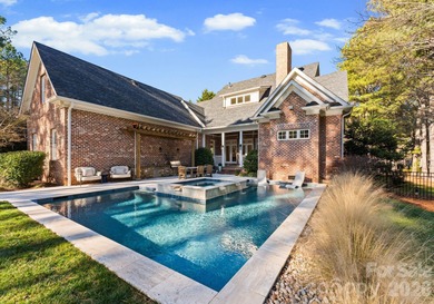 Timeless Southern charm meets lake living! Situated on a large on Trump National Golf Club Charlotte in North Carolina - for sale on GolfHomes.com, golf home, golf lot
