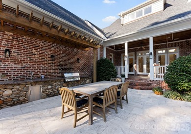 Timeless Southern charm meets lake living! Situated on a large on Trump National Golf Club Charlotte in North Carolina - for sale on GolfHomes.com, golf home, golf lot