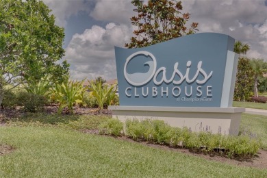 Discover the perfect blend of comfort, style, and location at on The Oasis Club at Champions Gate in Florida - for sale on GolfHomes.com, golf home, golf lot