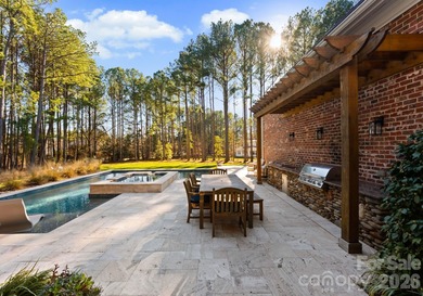 Timeless Southern charm meets lake living! Situated on a large on Trump National Golf Club Charlotte in North Carolina - for sale on GolfHomes.com, golf home, golf lot