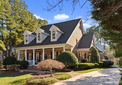 Timeless Southern charm meets lake living! Situated on a large on Trump National Golf Club Charlotte in North Carolina - for sale on GolfHomes.com, golf home, golf lot