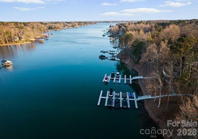 Timeless Southern charm meets lake living! Situated on a large on Trump National Golf Club Charlotte in North Carolina - for sale on GolfHomes.com, golf home, golf lot
