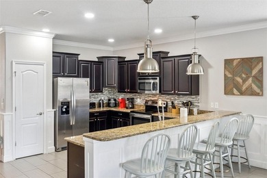 Welcome to 1414 Moon Valley Drive, a beautifully furnished on The Oasis Club at Champions Gate in Florida - for sale on GolfHomes.com, golf home, golf lot