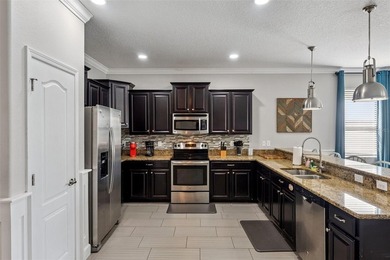 Welcome to 1414 Moon Valley Drive, a beautifully furnished on The Oasis Club at Champions Gate in Florida - for sale on GolfHomes.com, golf home, golf lot