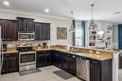 Welcome to 1414 Moon Valley Drive, a beautifully furnished on The Oasis Club at Champions Gate in Florida - for sale on GolfHomes.com, golf home, golf lot