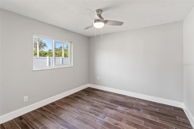 Tucked inside the coastal community of Shore Acres, this on Mangrove Bay Golf Course in Florida - for sale on GolfHomes.com, golf home, golf lot