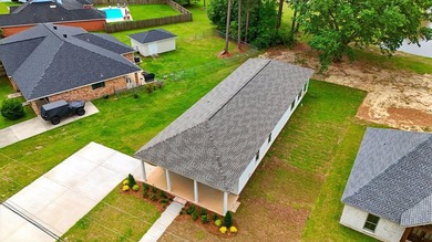 This CUSTOM built modern New Orleans style shotgun house has 3 on Millbrook Country Club in Mississippi - for sale on GolfHomes.com, golf home, golf lot