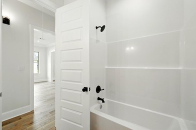 This CUSTOM built modern New Orleans style shotgun house has 3 on Millbrook Country Club in Mississippi - for sale on GolfHomes.com, golf home, golf lot