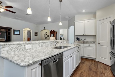 Welcome to a life that feels like vacation every day. Nestled in on Arlington Ridge Golf Club in Florida - for sale on GolfHomes.com, golf home, golf lot